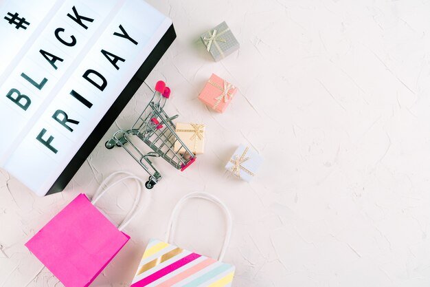 A calendar marked with important shopping dates like Black Friday, Cyber Monday, and Amazon Prime Day, surrounded by shopping-related icons and a magnifying glass.