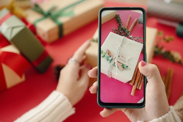 A close-up image of a smartphone displaying a personalized product recommendation on a shopping app. The recommendation is relevant to holiday shopping, showcasing a festive item. The image emphasizes the tailored experience driven by AI.