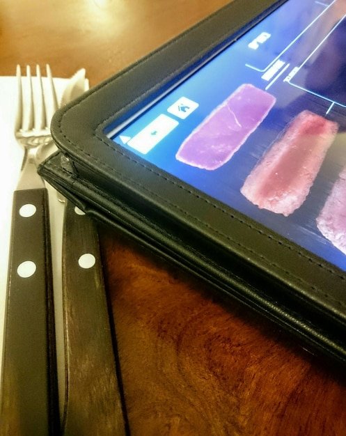 A close-up shot of a smartphone screen displaying a highly personalized product recommendation interface. The interface shows various products tailored to the user's previous purchases and browsing history, with options to add to cart or view more details.