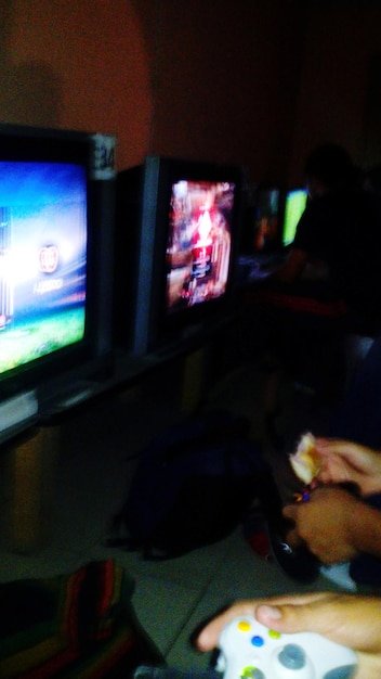 A futuristic gaming setup with a gamer wearing a VR headset and using advanced motion-tracking controllers. The scene is set in a dimly lit room with neon accents, emphasizing the high-tech aspect of VR gaming.