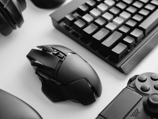 A close-up of a gaming mouse with advanced haptic feedback technology, showcasing the intricate details of the sensors, customizable buttons, and ergonomic design intended for extended use. The image focuses on subtle textures and the interplay of light, highlighting the precision and comfort.